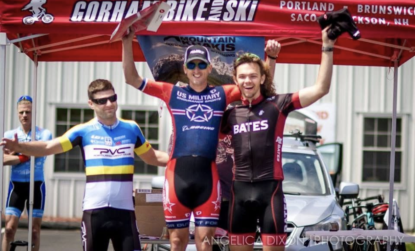 A Bates rider celebrating on a race podium